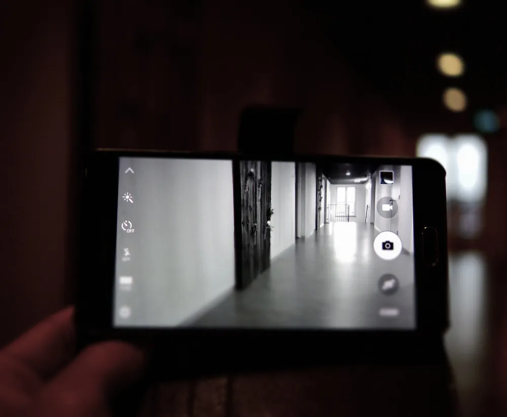 Mobile phone capturing hallway in video