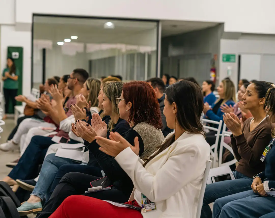 Seated audience applauding